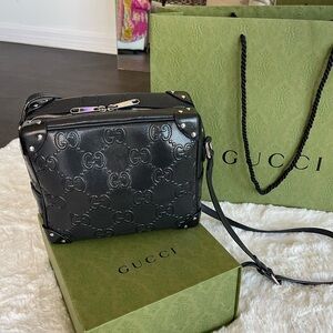 Gucci embossed cross body bag